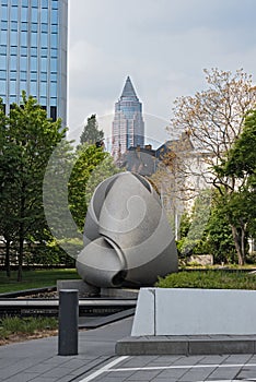 View of a sculpture and the messeturm in Frankfurt, Germany photo