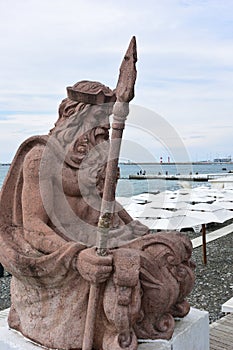 View of the sculpture of Neptune on the beach background Sochi,