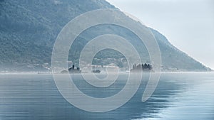 View on the sea bay of Kotor in Montenegro covered with early morning fog