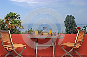 View of sea and blue sky from terrace in Spanish villa.