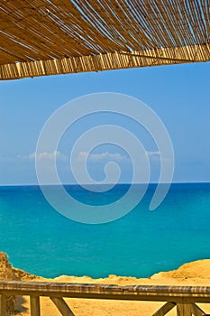 View of the sea from a cafe with Cane sunroof