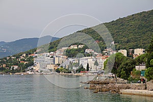 View of the sea coast, seaside and buildings close to the beach, beautiful Mediterranean coast in Opatija, Croatia, old Austro-Hun