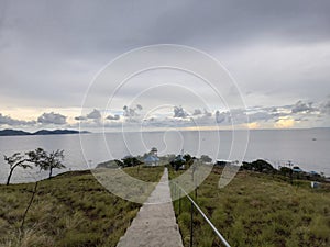 view of the sea and mountains in the evening when the sun sets, the location of Sikka Flores, Indonesia photo