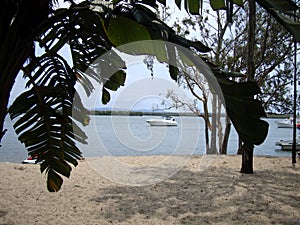 View on a sea through a natural window in Domenican republic photo