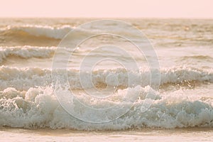 View sea ocean water surface with foaming small waves at sunset. Amazing landscape scenery. Ocean water foam splashes