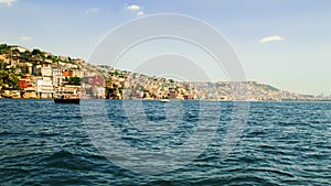 View from the sea of Posillipo hill, Naples and the blue waters photo