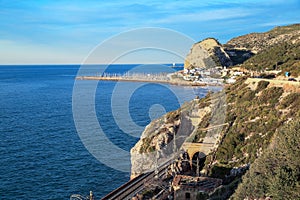 View of the sea and the railway tunnel near the town of El Garraf. Spain.
