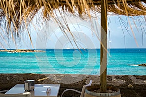 View of the sea of Sardinia by a cafe.