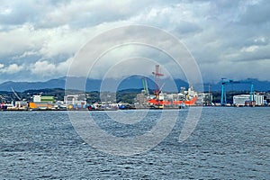 View from the sea of Southampton port on a cloudy day before rain