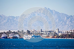 The view of sea, town and mountains in Hurghada, Egypt. Tourism and travel concept