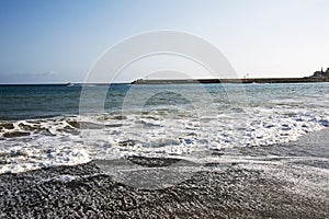 View of the sea waves` backwash