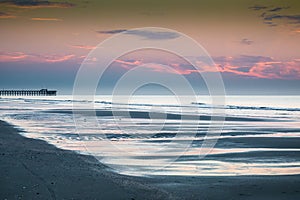 View of sea waves breaking beach during susnet