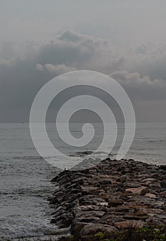 View of sea waves hitting rocks on the Calm beach in the morning