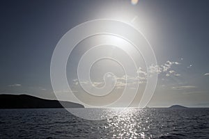 A view of a seascape and horizon under sunset in the island of Patmos, Greece