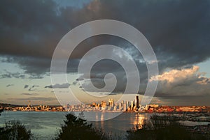 Seattle Skyline During a Dramatic Sunset and a Rain Squall Passing Through. photo