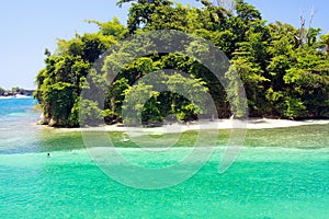 View on secluded islet with white sand and turquoise water - Blue lagoon in Portland, Jamaica