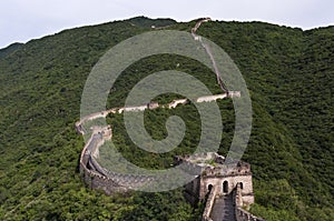 View of a section of the Great Wall of China and the surrounding mountains in Mutianyu