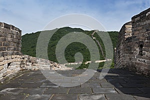 View of a section of the Great Wall of China and the surrounding mountains in Mutianyu