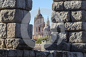View of segovia cathedral through an aqueduct arch, in autonomous region of Castile and LeÃÂ³n.  Declared World Heritage Sites by photo