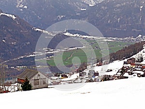View of the settlement of Amden above the Lake Walen or Lake Walenstadt Walensee and the fertile lowlands - Switzerland