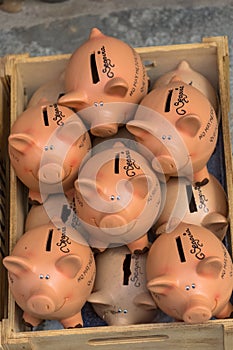 View of several handmade clay pigs, traditional in Segovia, for sale in a market photo