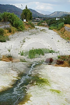 View of the shallow river bed Fonias in Lardos in August. Rhodes Island, Greece