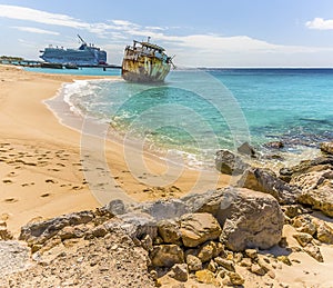 A view of a shipwreck on Governors beach on Grand Turk with the Cruise terminal in the background