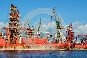 View of the shipyard with historical cranes in the industrial part of the city Gdansk in Poland. The shipyard is