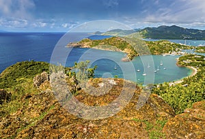 A view from Shirley Heights viewpoint down into Freemans Bay on the coast of Antigua photo