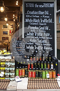 View of shopboard with bottles puring virgin olive oil