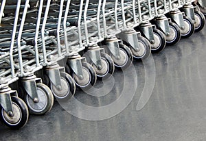 View of shopping carts in a row at the retail super market