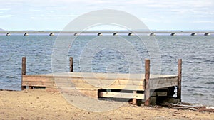 A view from the shore of a low-water bridge from the Sedanka station to the De Friz peninsula through the Amur Bay in the far east