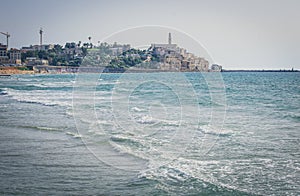 View from the shore of the Mediterranean Sea on Old Jaffa, Tel Aviv, Israel.