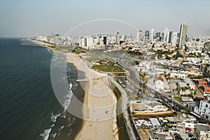 view from the shore to the modern district of Tel Aviv. Top view of the capital of Israel. Clean beautiful beach in the city