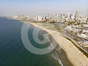 view from the shore to the modern district of Tel Aviv. Top view of the capital of Israel. Clean beautiful beach in the city