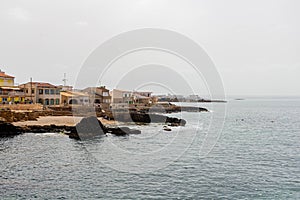 View of the shore with town buildings. Illes Balears, Spain. photo