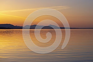 Shoreline of Vancouver Island at sunset from the Salish sea photo