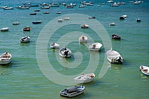 view showing many small fishing boats anchored in the water