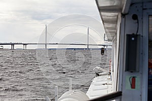 The view from the side of the boat on the viaduct of the Western High Speed Diameter in the Petrovsky waterway. St. Petersburg,