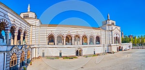 The view on the side covered gallery of Famedio, the main building of Monumental Cemetery of Milan, Italy