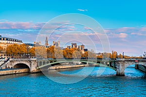 View on Siene river, Notre Dame bridge and Hotel de Ville. Autumn city Paris, France