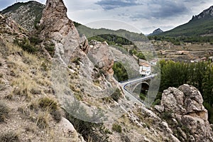 View of Sierra de San Just mountain and the bridge over MartÃÂ­n river in Montalban, Teruel province photo
