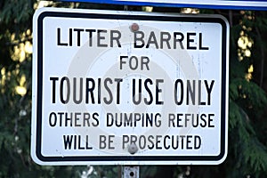 View of sign Litter Barrel for Tourist Use only, Others dumping refuse will be prosecuted