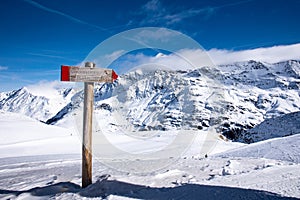 View of a sign near the Punta San Matteo peak in the Alps photo