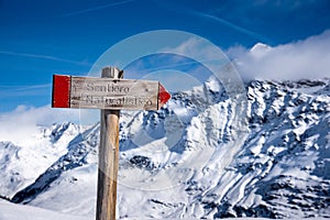 View of a sign near the Punta San Matteo peak in the Alps photo