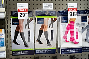 View of Sigvaris compression socks boxes on pharmacy shelf.