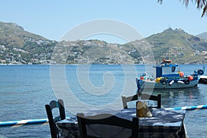 View of a siimple old fashioned Greek taverna by the seaside on the small Greek island of Telendos.