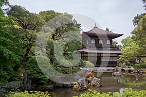 View of Silver Pavilion at Ginkakuji Temple with bonsai trees and pond