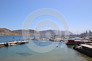 View of Simon`s Bay with town pier, marina and dockyard.  Simon`s Town, South Africa.