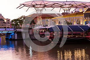 Singapore river, boat and Clarke Quay area